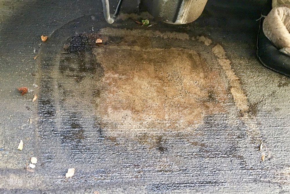 Outline of old fashioned spill socks and sheets reveals that rain washes transformer oil leaks over top and onto surrounding surfaces.