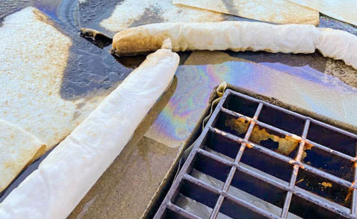 Standard absorbents let oil escape down the drain in wet weather