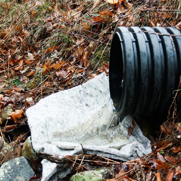 Husky Rug and Pads below black culvert pipe