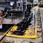 Train washdown berm