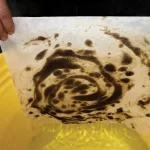 remove sheen from water with oil shammy towels